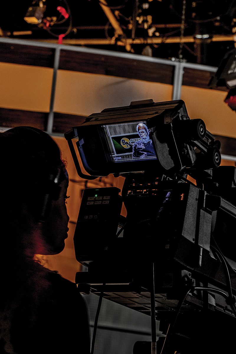 A crew member frames Everett Marshburn in their camera monitor. Photo by TJ Lambert/Stages Photography