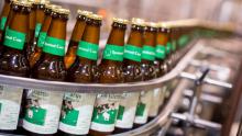 Bottles of New Glarus Brewing Company's signature beer come off the production line. Soon, all New Glarus bottles will be sourced from Ardagh glass manufacturing plant in Burlington, adding another dimension to the Spotted Cow tagline: Only in Wisconsin. Photo by Andy Manis.