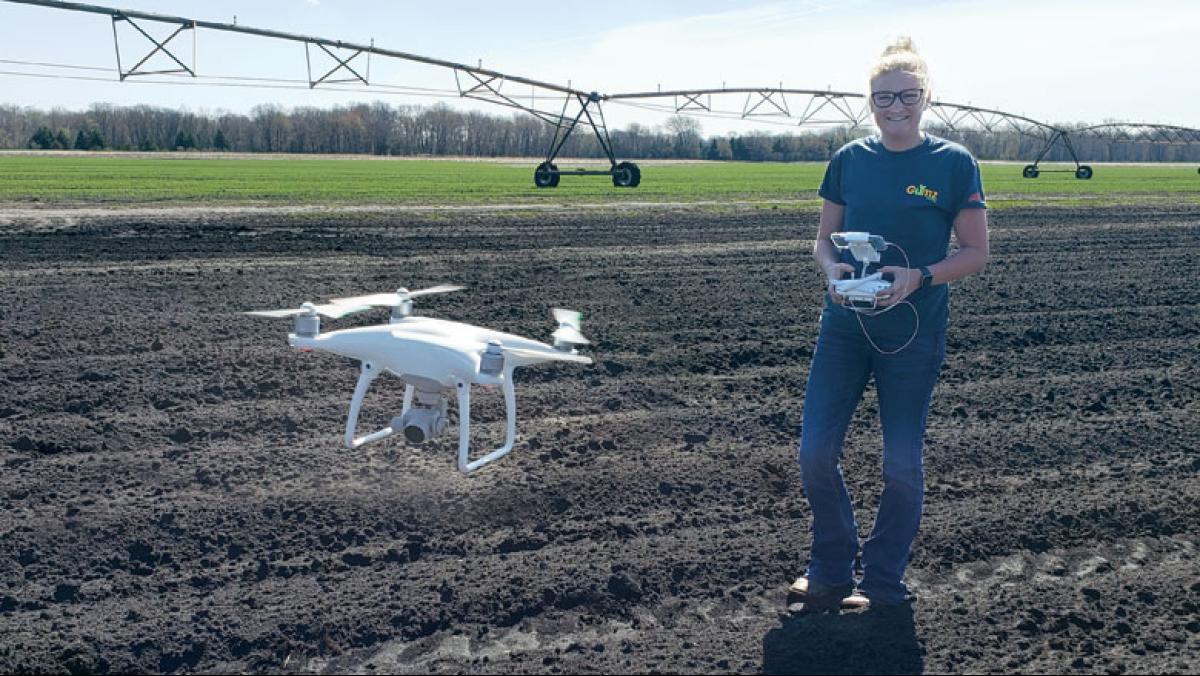 Moriah Rataczak uses her Phantom 4 quadcopter—more commonly known as a drone—to monitor field conditions for Gumz Farms. Photo by Cassie Smith-Krebs.