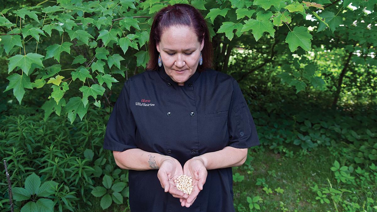 Chef Elena Terry holds ancestral corn seeds. Photo by Tom Jones. No reproduction without permission. 