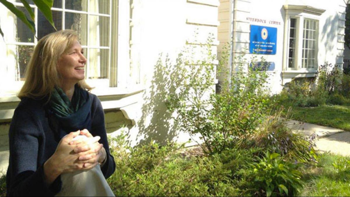 Photo of Jane Elder in front of Academy offices