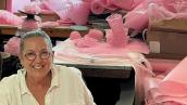 Image of artist in her studio surrounded by materials