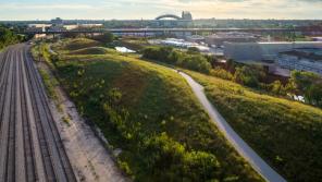 This 24-acre stretch of land along the Menomonee River in Milwaukee used to be an abandoned rail yard. In 2013 a group of state and local partners completed its transformation into an urban green space. Today, Three Bridges Park is home to an urban ecology center and bike paths, and hosts over 50,000 visitors every year. Photo by Jon Elliott/MKE Drones.