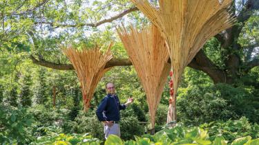 Peter Krsko stands amidst Renewal (with collaborating artist Katie Schofield’s Turkey Tails), one in a series of bio-inspired art installations on view at Olbrich Botanical Gardens in Madison. Photo by TJ Lambert/Stages Photography.