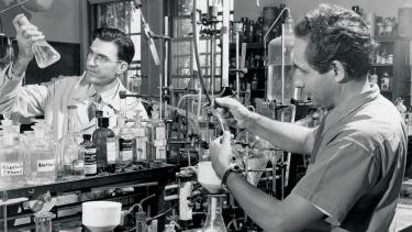 Karl Paul Link (right), the biochemist who discovered warfarin, and Mark A. Stahmann (left) perform a laboratory procedure at the Wisconsin Agricultural Experiment Station in 1949.  UW Digital Collections/ID S05108