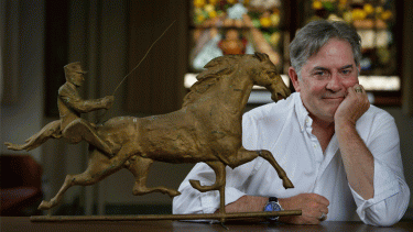 Mark Moran with a weathervane from the late 1800s at the History Museum at the Castle in Appleton, 2014. Photo by Sharon Cekada.